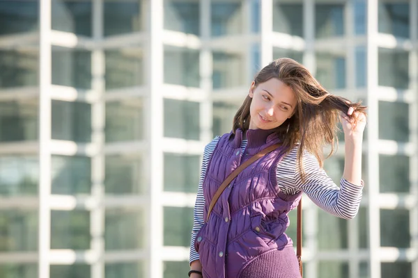 Girl in a a sleeveless jacket — Stock Photo, Image