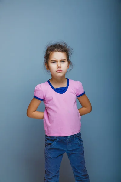 Girl frowned looking at the camera — Stock Photo, Image