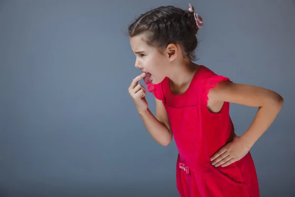 Girl put a finger in his mouth disgusted — Stock Photo, Image