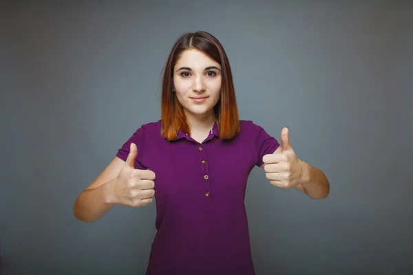 Muchacha mostrando pulgares hacia arriba signo sí —  Fotos de Stock