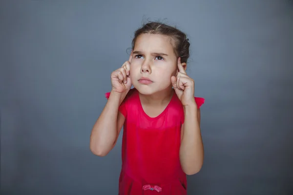 Teen girl squeezed finger a to his temple thinks — Stock Photo, Image