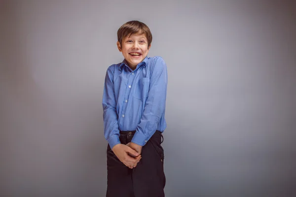 Teenager boy brown hair European appearance laughing and looking — Stock Photo, Image