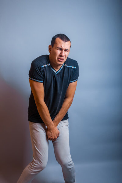 the man European appearance brunet holding hands over