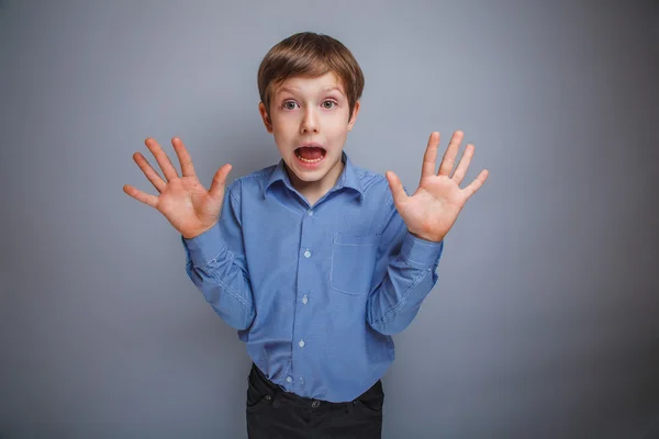 Boy showing his hands gasped emotions — Stock Photo, Image