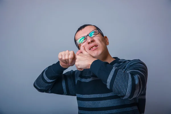 Man of European appearance years presses pimple on — Stock Photo, Image