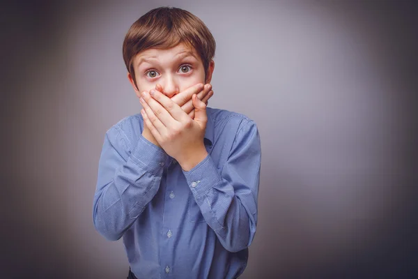 Teenager boy years of European appearance surprised closed — Stock Photo, Image