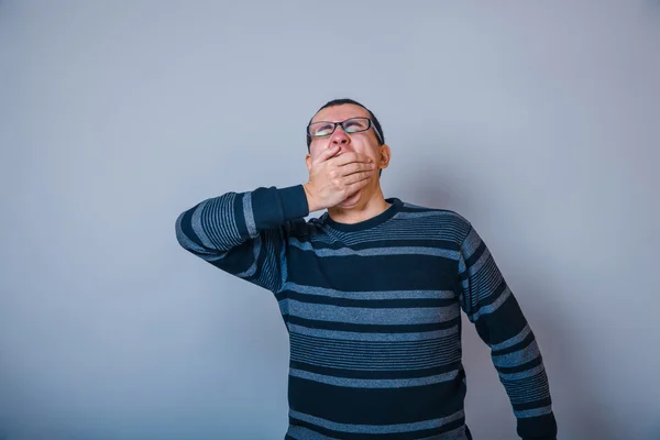 European-looking man of 30 years in glasses wants to sleep, yawn — Stock Photo, Image