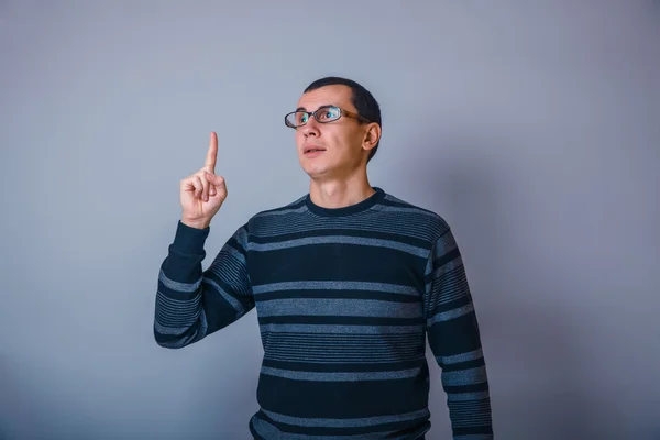 European-looking man of 30 years teacher glasses idea on a gray — Stock Photo, Image