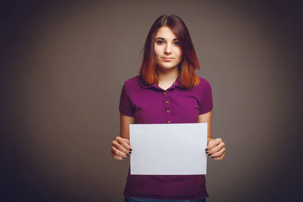 Female years of European appearance holds clean sheet — Stock Photo, Image