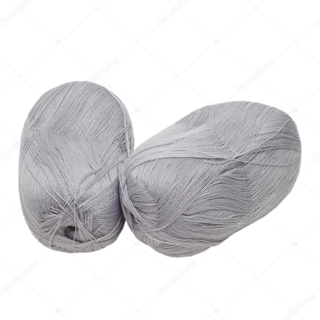 gray balls of yarn are isolated on a white background