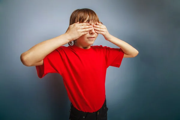 Boy teenager European appearance in a red shirt closed eyes with — Stock Photo, Image