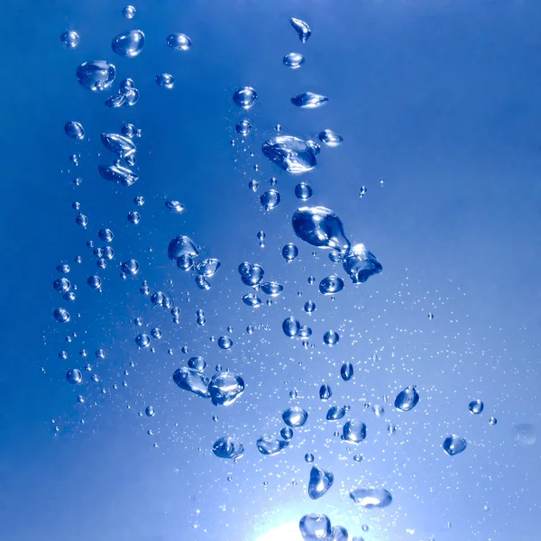 Blue water with bubbles and drops background — Stock Photo, Image