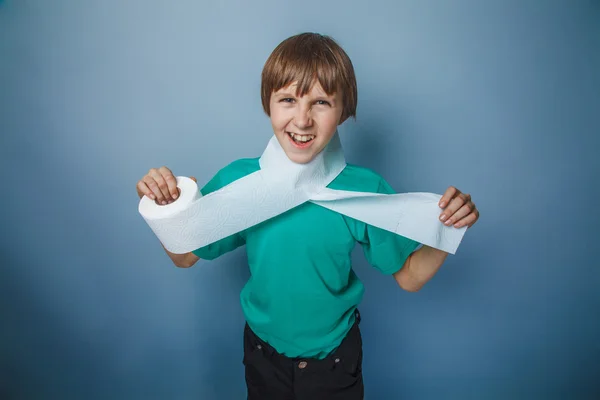 European-looking boy of ten years with toilet paper, wants to us — Stock Photo, Image