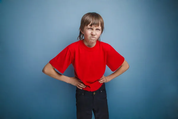 Boy, teenager, twelve years in the red shirt, hands in the side, — Stock Photo, Image