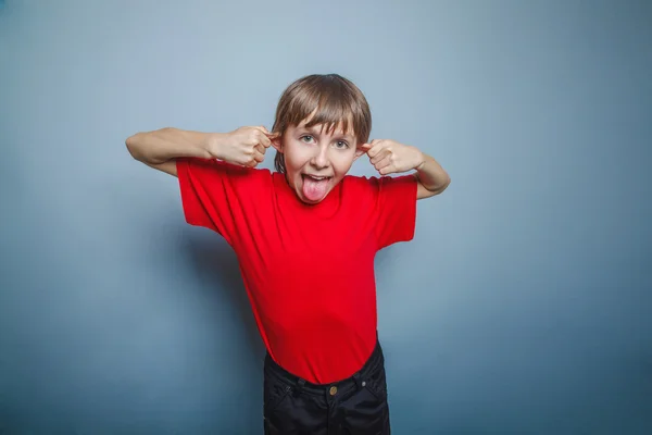 Boy, teenager, twelve years in the red shirt, pulled ears, — Stock Photo, Image