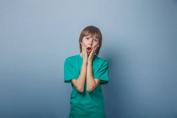 Boy, teenager, twelve years a  in  shirt green, opened  mouth hi — Stock Photo, Image