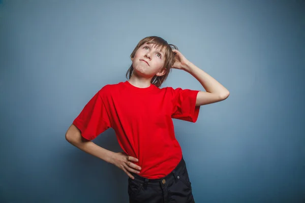 Boy, teenager, twelve years in the red shirt, thoughtful, derzhe — Stock Photo, Image