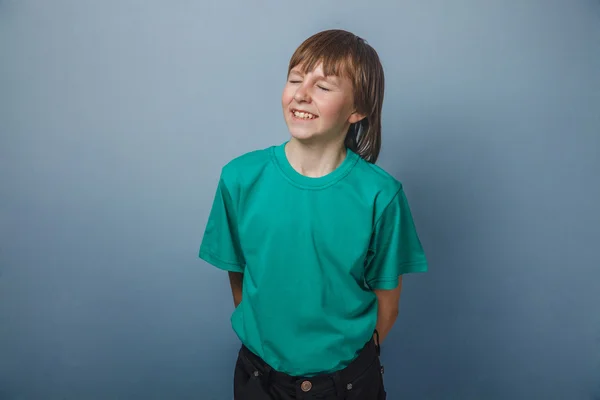 Boy , teenager, twelve years in a green shirt, closed his eyes — Stock Photo, Image