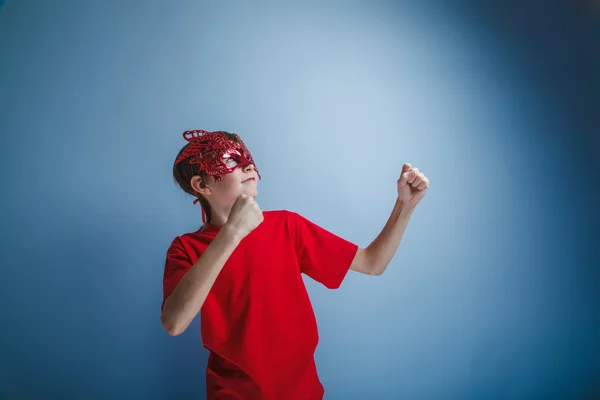 Boy teenager European appearance in a red shirt brown in a red m — Stock Photo, Image