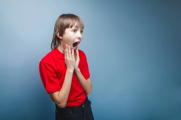 Teenager boy opened his mouth European appearance screams kept h — Stock Photo, Image