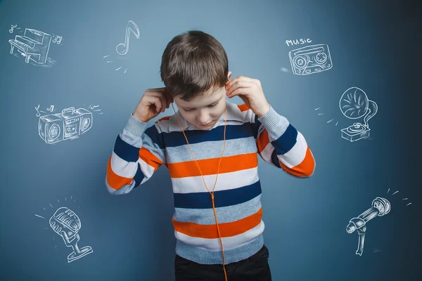 Teenager boy of about ten European appearance brown hair listeni — Stock Photo, Image