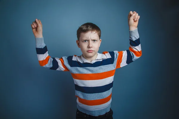 Teenager boy of about ten European appearance Brown frowned hold — Stock Photo, Image