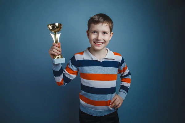 Teenager boy of about ten European appearance brown hair holding — Stock Photo, Image