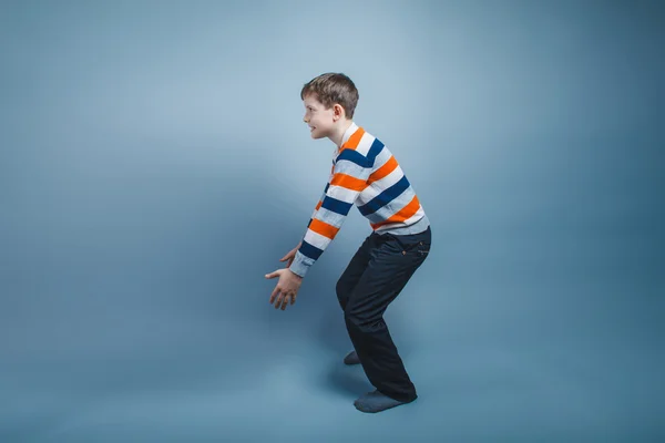 Eenager boy standing European appearance on the floor stretched — Stock Photo, Image