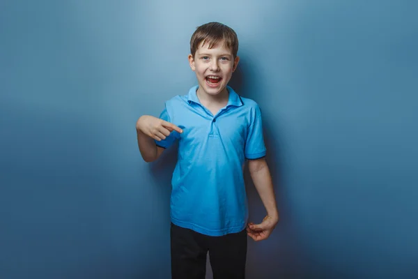 Boy teenager European appearance decade fingers pointing down on — Stock Photo, Image