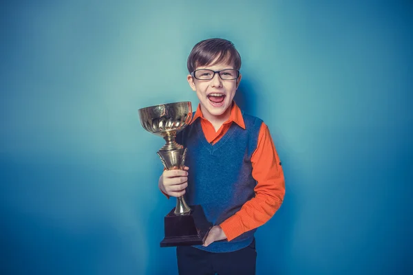 European -looking  boy of  ten years  in glasses holding a cup, — Stock Photo, Image