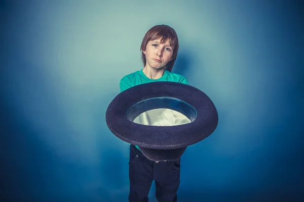 European-looking  boy  of ten years beggar holding hat in hand o — Stock Photo, Image