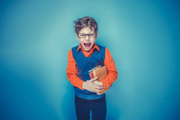 European-looking  boy of ten years in glasses  opened his mouth — Stock Photo, Image