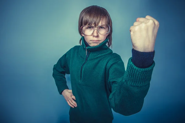 European- looking boy  of ten  years  in glasses frowning,  unha — Stock Photo, Image