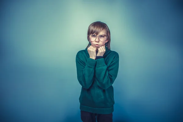 Teenager boy with glasses lips blowing  antics emotions fists in — Stock Photo, Image