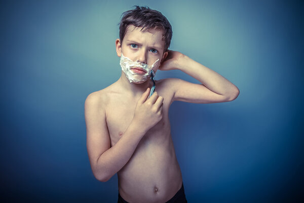 Teen boy shirtless European appearance in brown hair foam on his