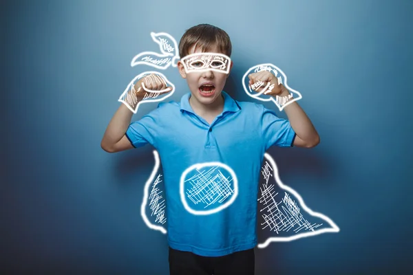 Teenager boy Brown European appearance in a blue T-shirt shows t — Stock Photo, Image