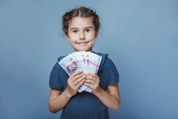 Girl child European appearance ten years  holding a wad of money — Stock Photo, Image