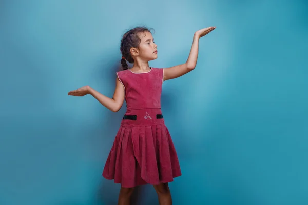 Girl European appearance ten years shows gesture scales hands on — Stock Photo, Image