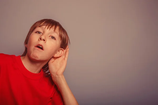 European appearance  boy overhears  a decade, interest, ear on g — Stock Photo, Image