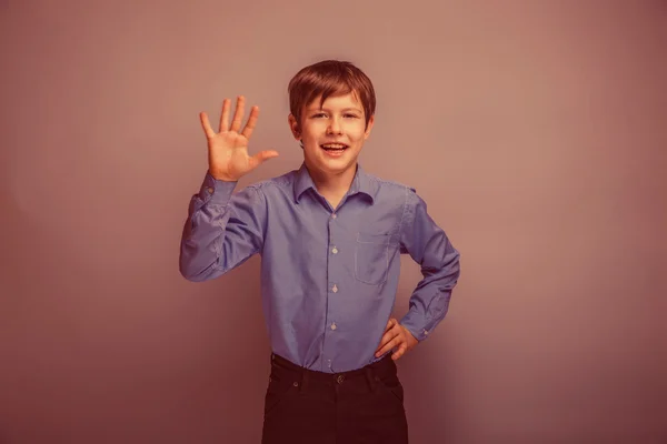 Teenager boy brown hair of European appearance waving experienci — Stock Photo, Image