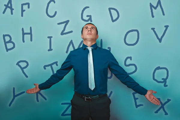 Man male teacher businessman alphabet letters fall from the top — Stock fotografie
