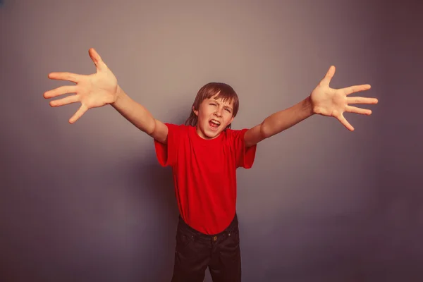 Ragazzo dall'aspetto europeo di dieci anni allungò le mani, palme forw — Foto Stock