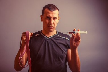 portrait of a man of European appearance brunet holding a tourni