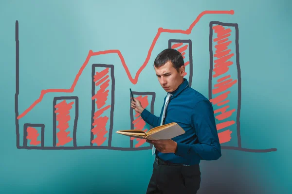Businessman showing a man holding a book on a graph business gro — Stock Photo, Image