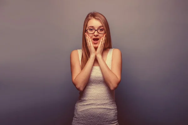 European-looking girl of twenty years surprise, opened her mouth — Stock Photo, Image