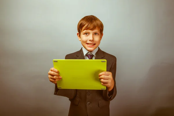 Boy teenager dressed businessman holding tablet Photo Studio ret — Stockfoto