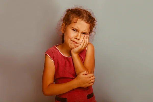 Girl European  appearance decade toothache on  blue background r — Stock fotografie