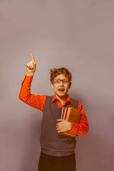 European-looking  boy of  ten years  in glasses thumbs up, the i — Stock Photo, Image