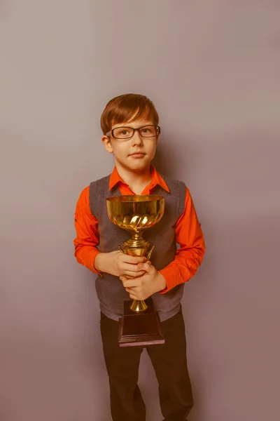 European-looking  boy of ten years in glasses holding a cup, awa — Stock Photo, Image