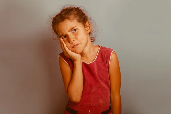 Girl European appearance decade  toothache on a blue background — Stock Photo, Image